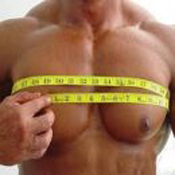 Picture of a man's chest and he is holding a measuring tape